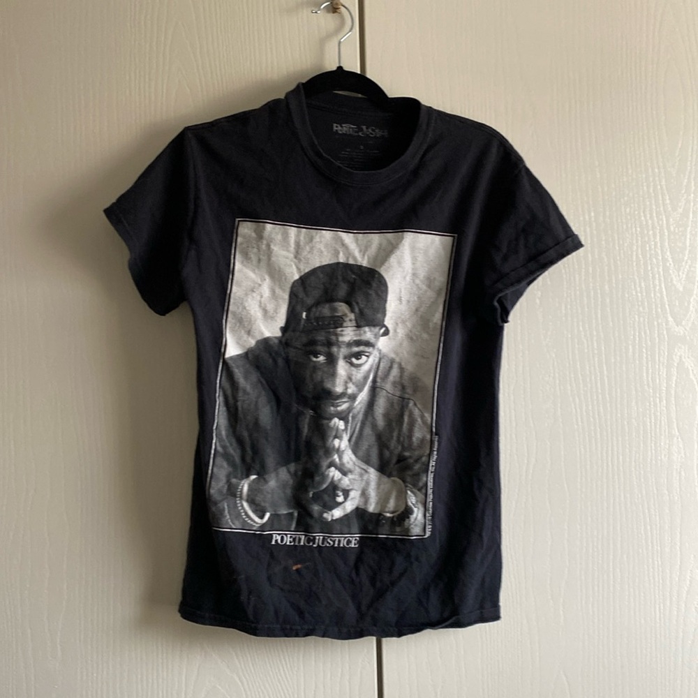 Tupac themed t-shirt with short sleeves. Worn a few times and has a bleach stain
